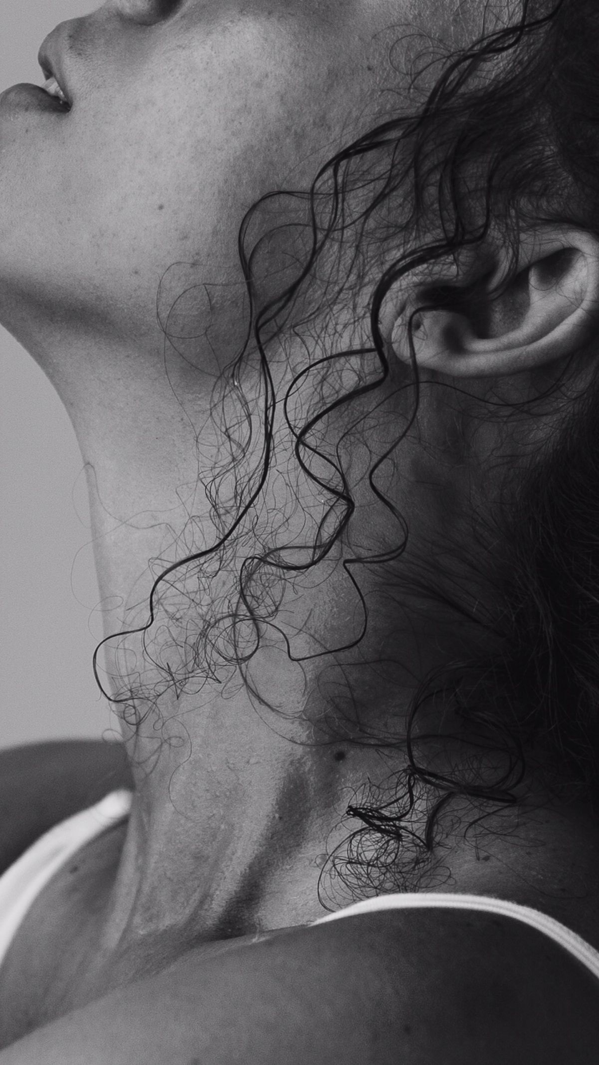 Close detail of curls against the neck and ear